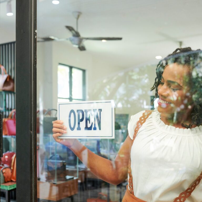 Shop assistant opening store